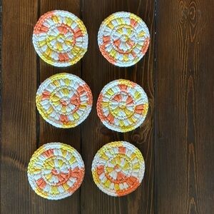 6 crocheted coasters orange , yellow and white